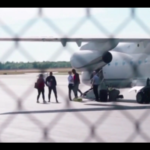 Migrants taking to airplane to go to Martha’s Vineyards.