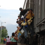 La,Patrona,,Veracruz/mexico-february,,2012.,Central,Americans,Clinging,To,The,Freight